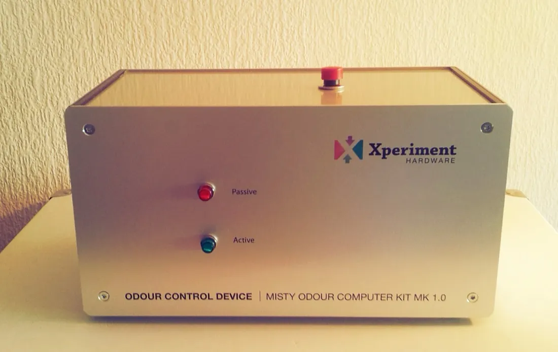 The front panel of the odour control device: a brushed aluminium case badged ‘Xperiment Hardware’, with red and green indicator lamps labelled Passive and Active, and ‘Odour Control Device | Misty Odour Computer Kit Mk 1.0’ along the bottom.